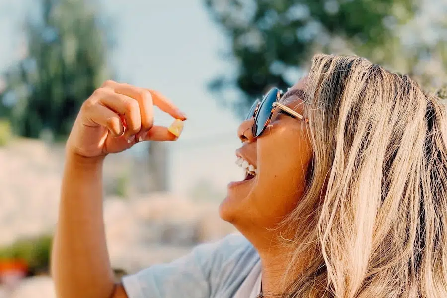 Woman about to eat a gummy treat