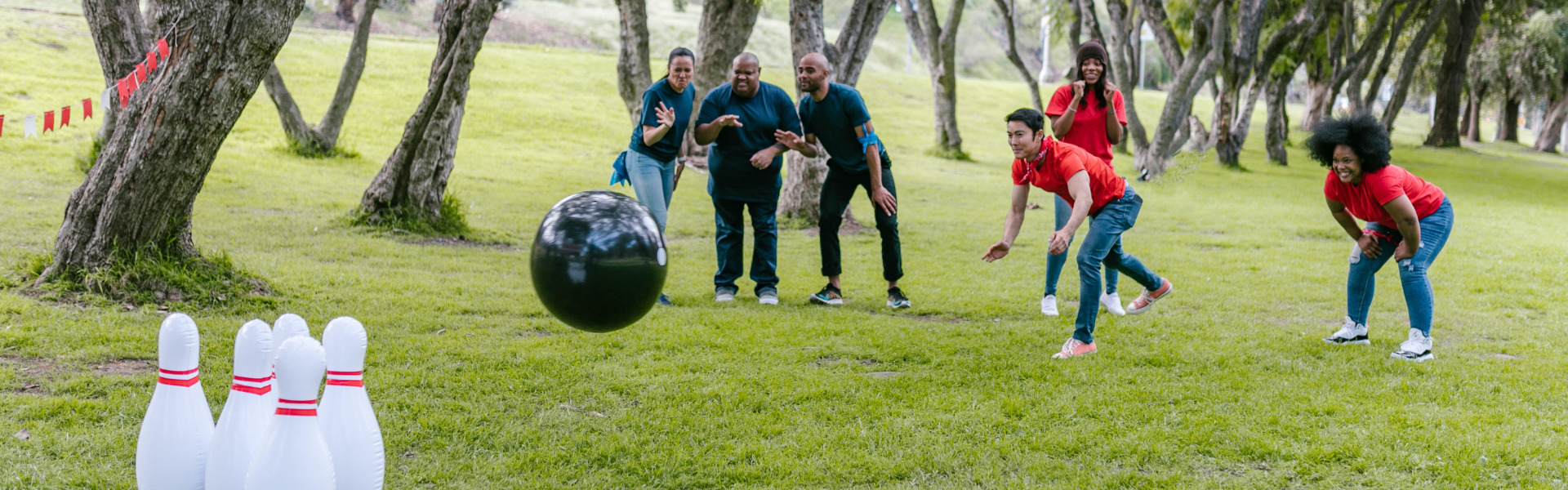Group of adults playing a lawn bowling game