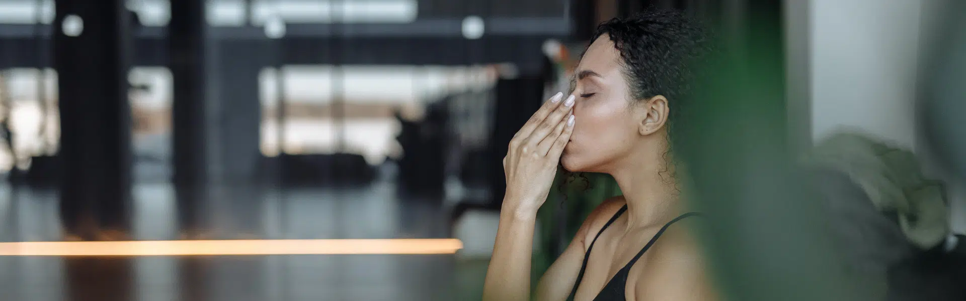 Woman practicing alternate nostril breathing