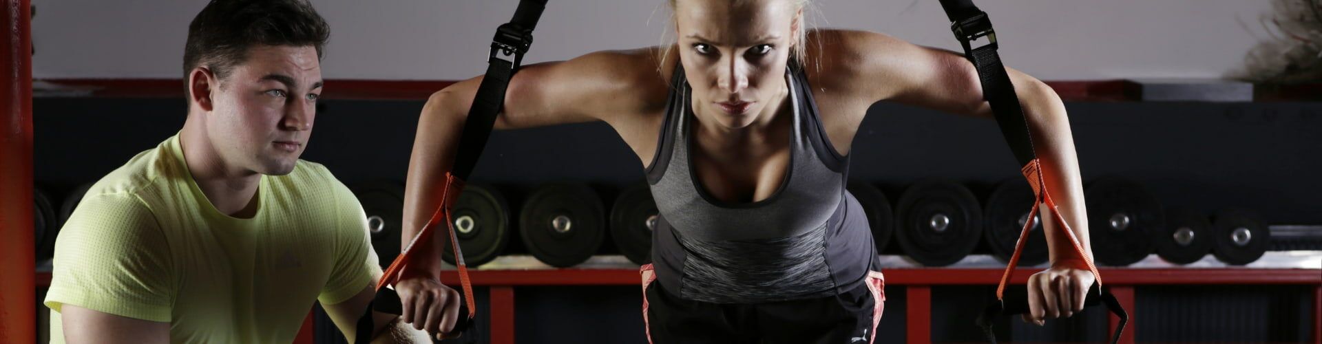 Woman doing lifting reps with training partner