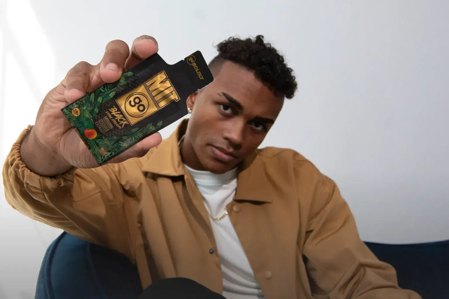 Man holding MIT45 GO pouch